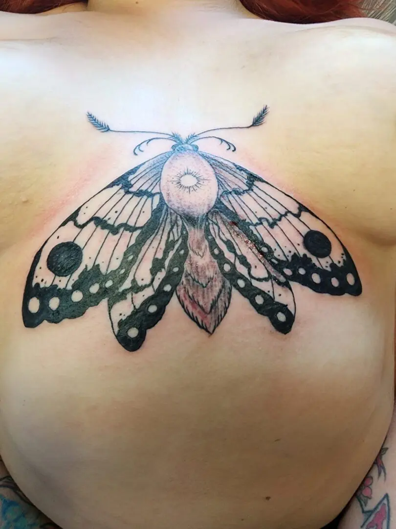 A huge butterfly as a chest tattoo