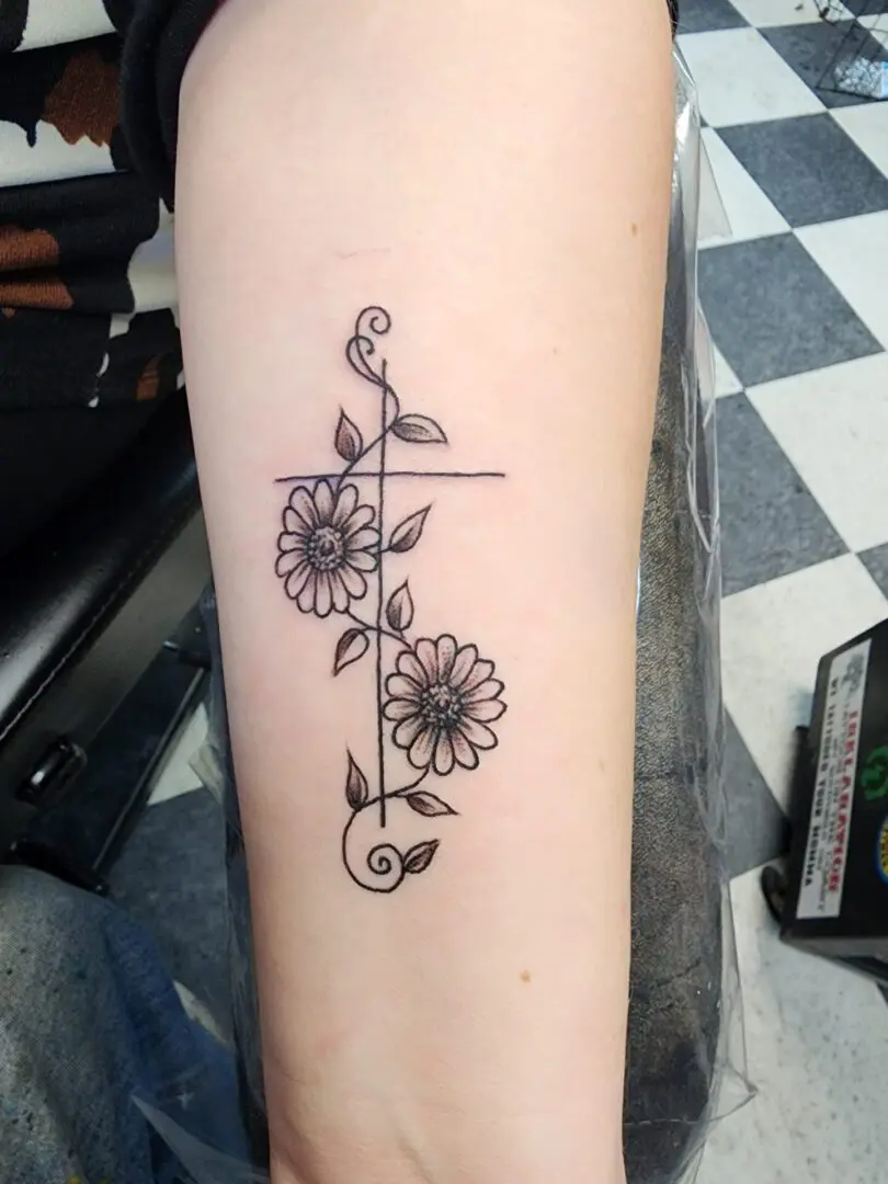 A beautiful flower design as an arm tattoo
